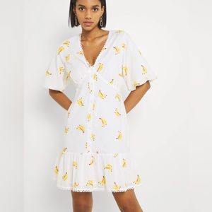FUN! US 4 White Banana Print mini dress with puff sleeves